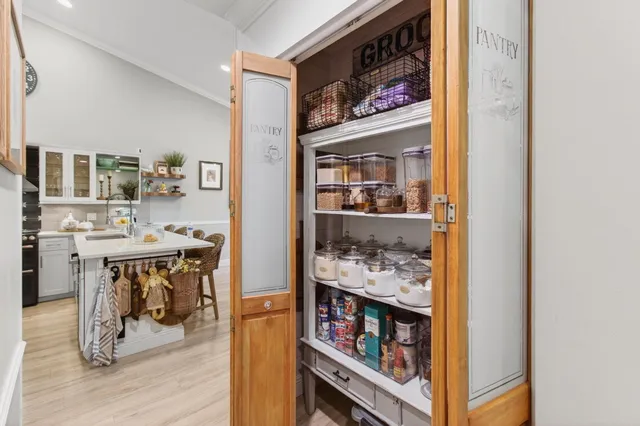 a view of a hallway with washer and dryer