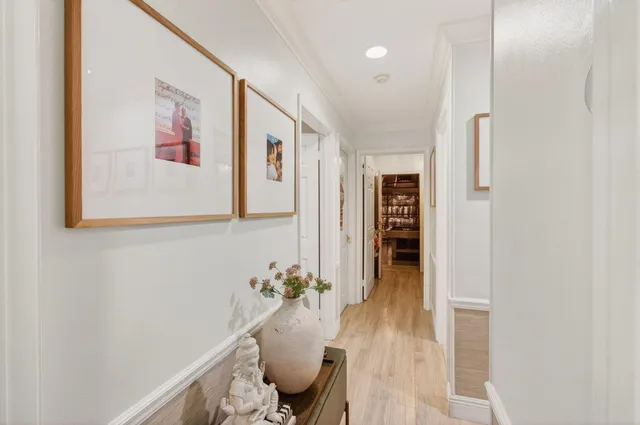 a living room with furniture a rug and a window