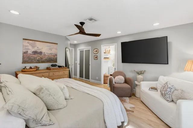 a view of a lake with a house in the background