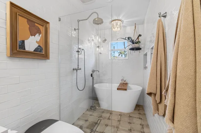 a view of a chair and table in the garden in the back