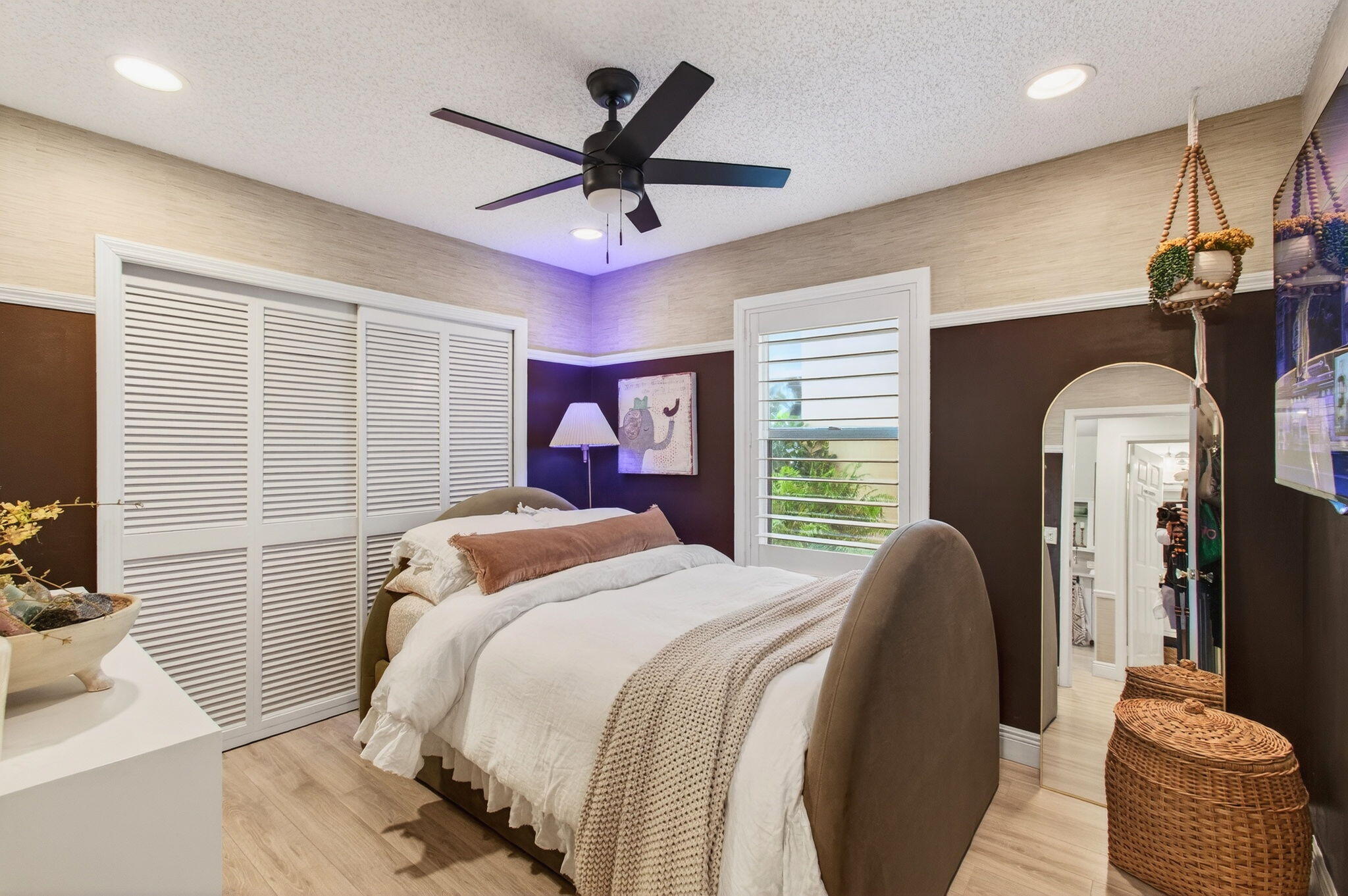 21400 Millbrook Court Boca Raton, FL 33498 - Photo 29 of 65 a bedroom with a large bed and a chandelier