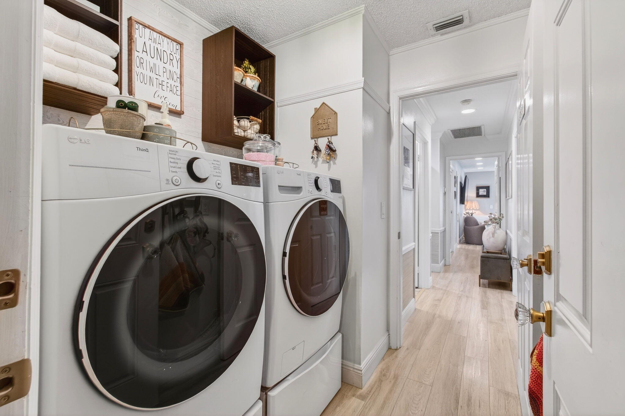 21400 Millbrook Court Boca Raton, FL 33498 - Photo 38 of 65 a view of a hallway with washer and dryer