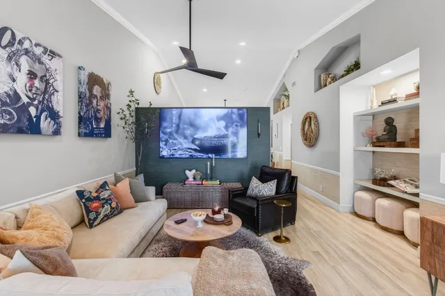 a living room with furniture a window and a fireplace