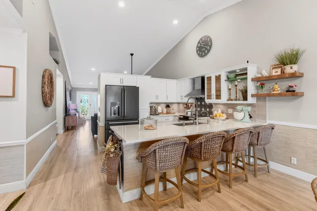 a view of a dining room with furniture wooden floor and chandelier