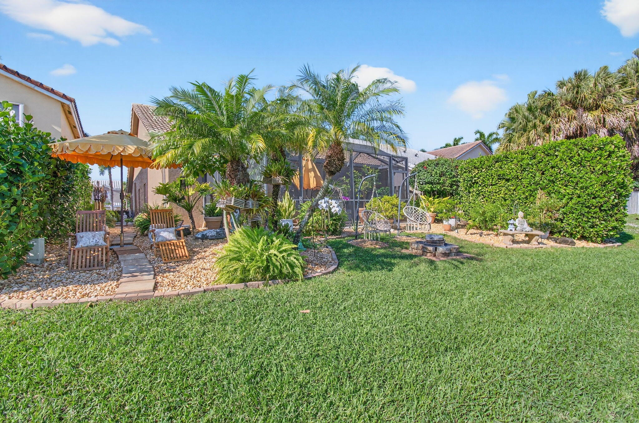 21400 Millbrook Court Boca Raton, FL 33498 - Photo 59 of 65 a view of a backyard with plants and a patio