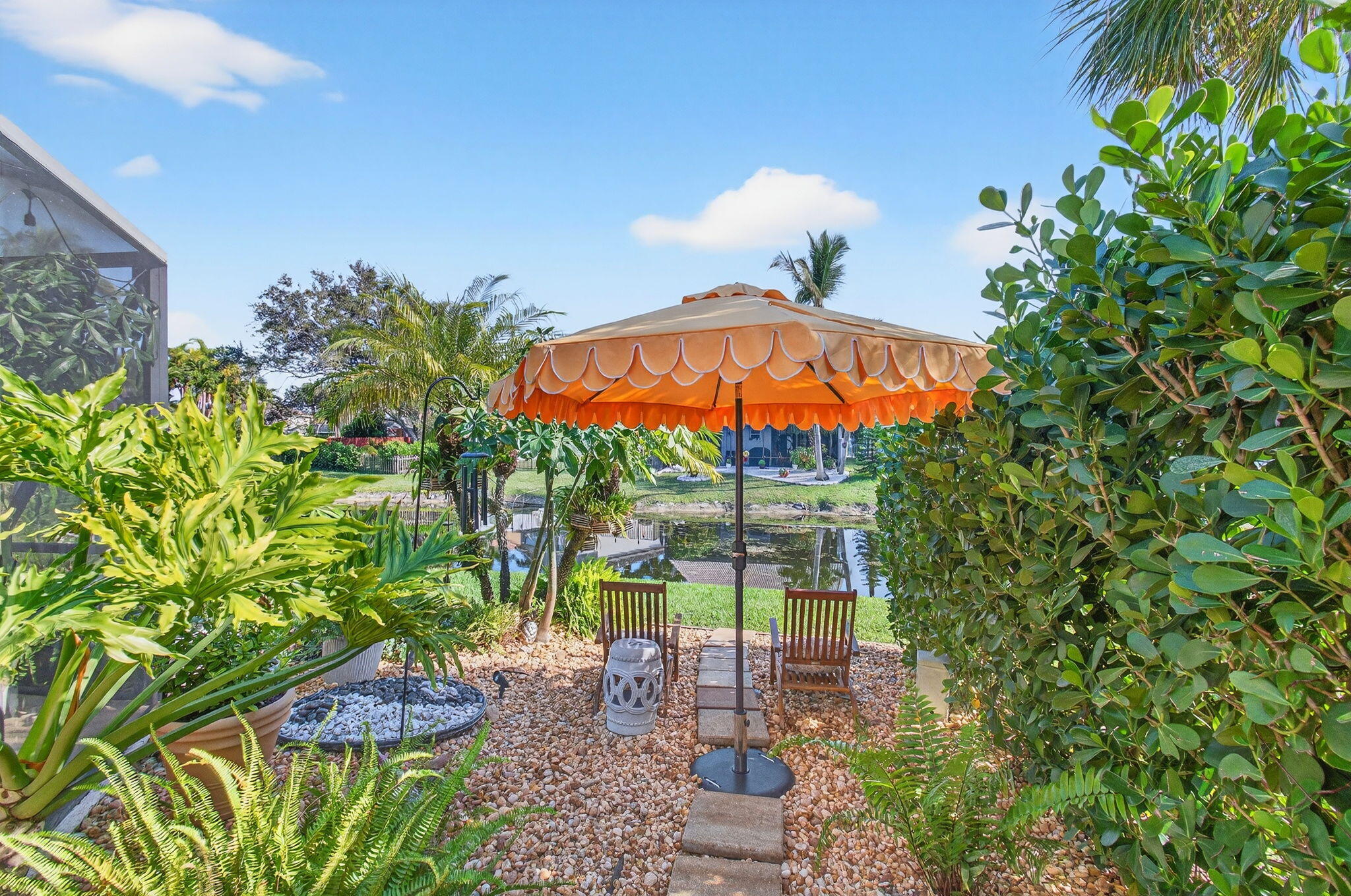 21400 Millbrook Court Boca Raton, FL 33498 - Photo 63 of 65 a view of a backyard with plants and a garden