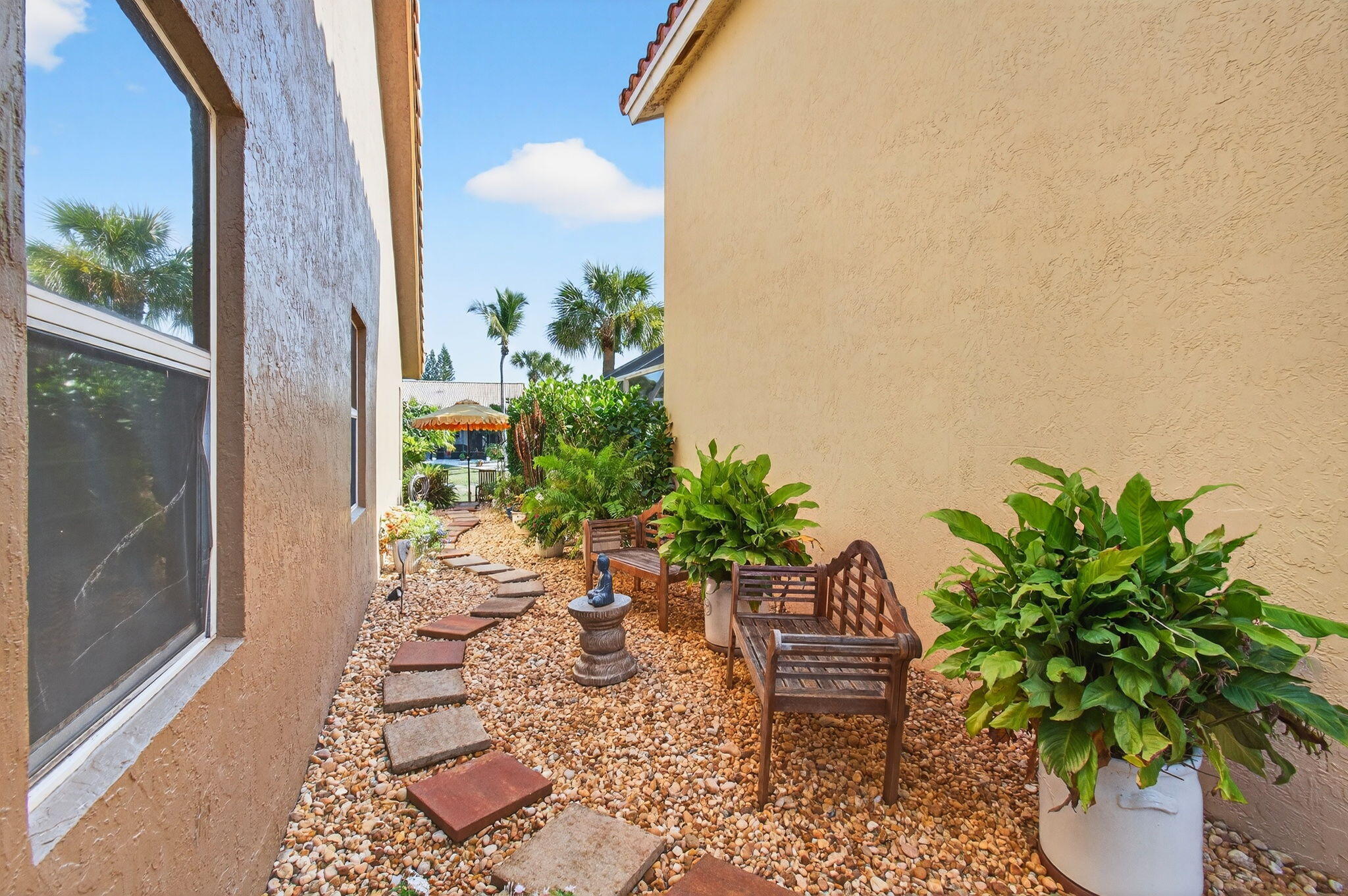 21400 Millbrook Court Boca Raton, FL 33498 - Photo 64 of 65 a view of a chairs and table in the patio