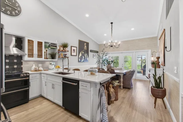 a kitchen with a sink stove and cabinets