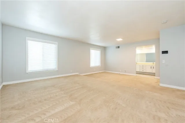 a view of empty room with windows