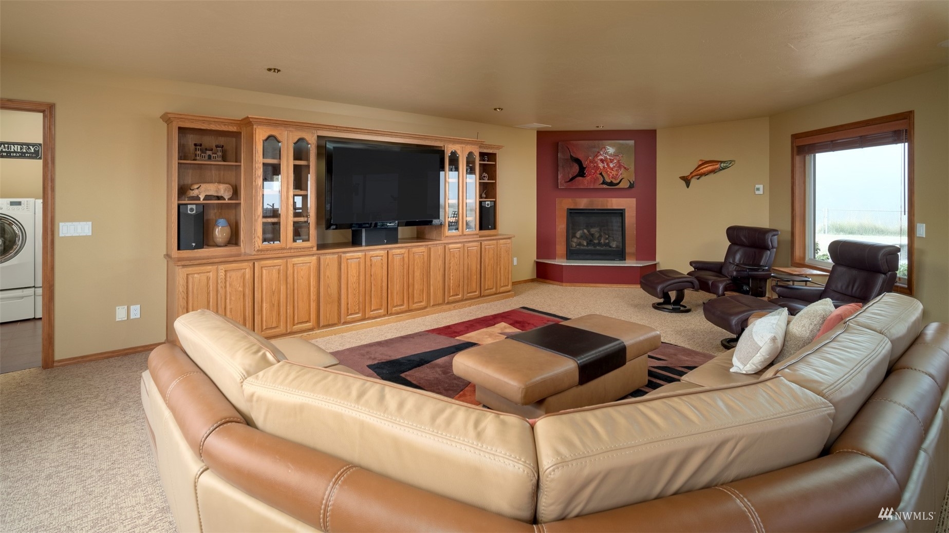 213 Mariners Point Road Sequim, WA 98382 - Photo 17 of 40 a living room with furniture and a flat screen tv