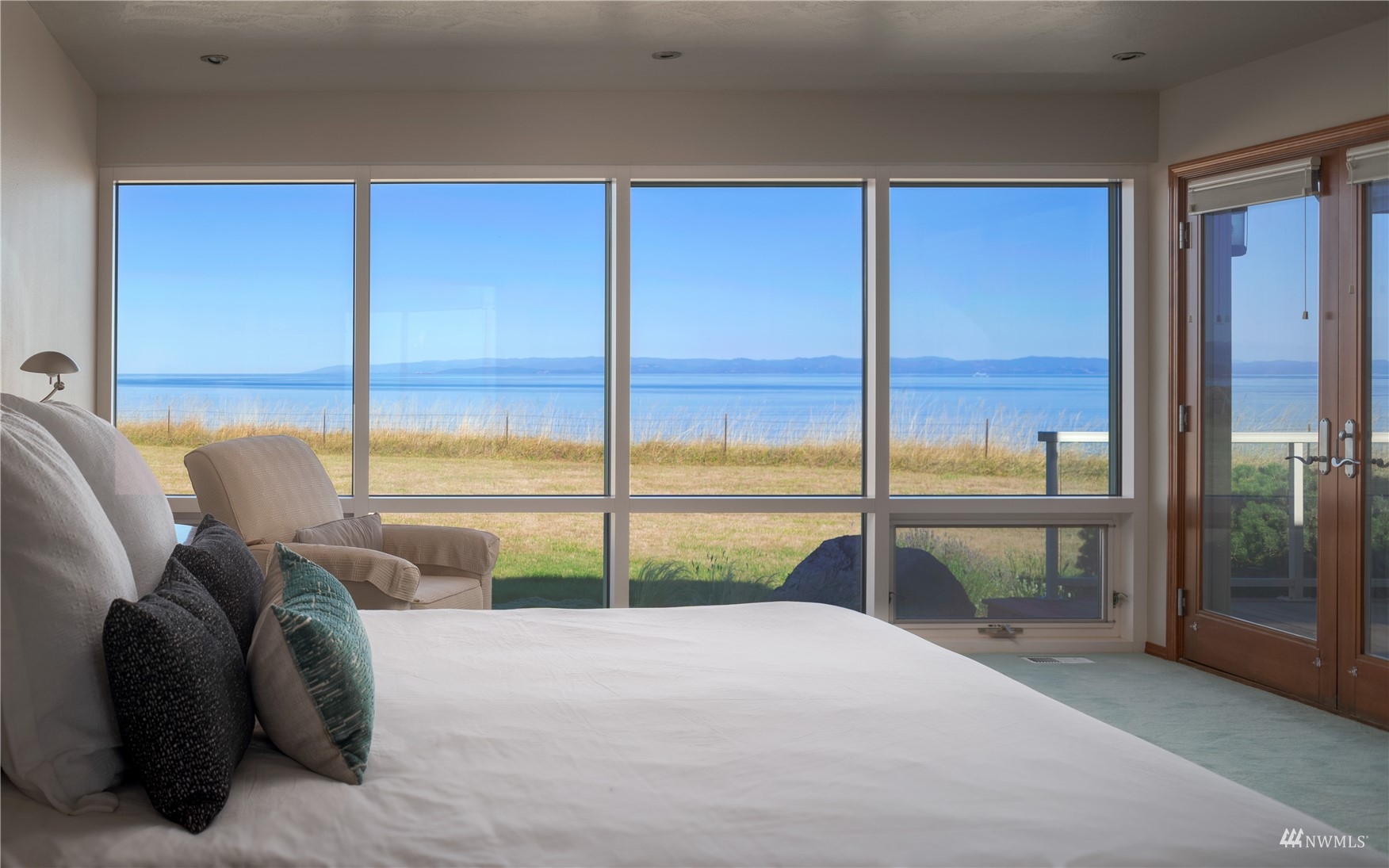 213 Mariners Point Road Sequim, WA 98382 - Photo 20 of 40 a view of a living room with a balcony bed and balcony