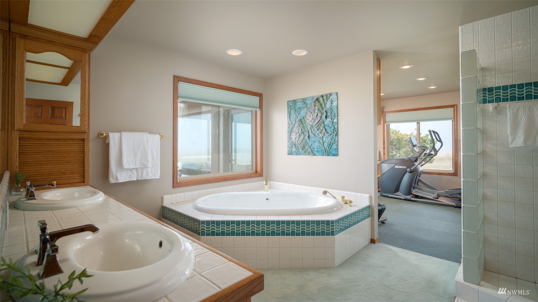 213 Mariners Point Road Sequim, WA 98382 - Photo 24 of 40 a spacious bathroom with a tub sink and mirror
