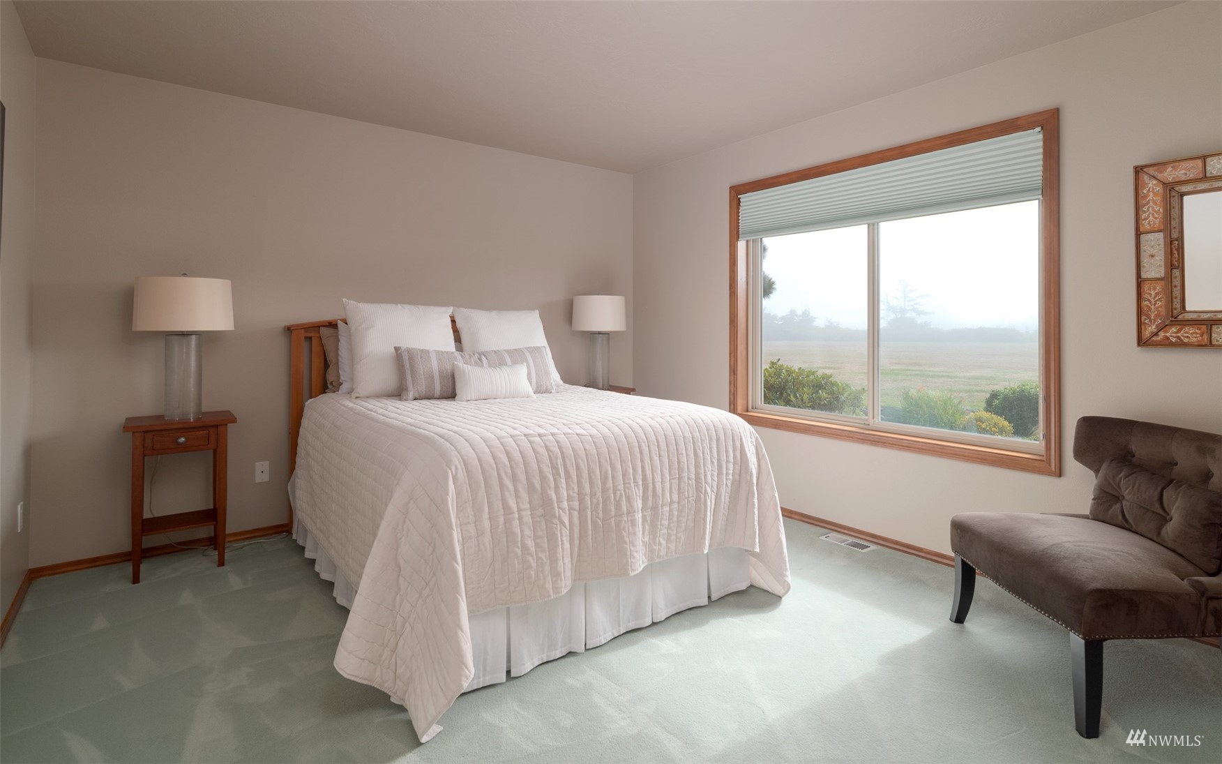 213 Mariners Point Road Sequim, WA 98382 - Photo 27 of 40 a bedroom with a bed and a couch