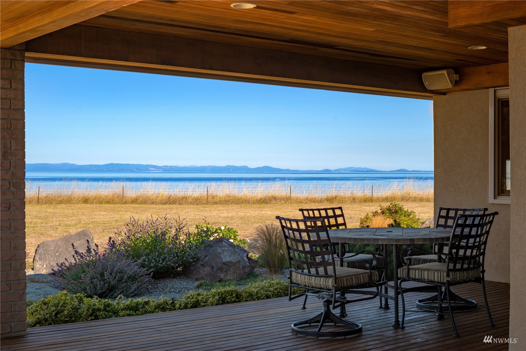 213 Mariners Point Road Sequim, WA 98382 - Photo 29 of 40 a view of chairs and table in the patio