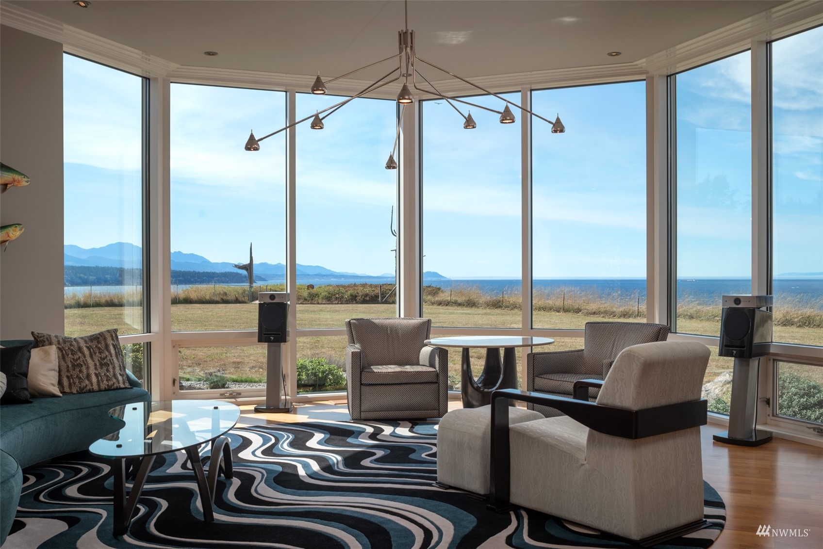 213 Mariners Point Road Sequim, WA 98382 - Photo 7 of 40 a living room with furniture and floor to ceiling windows