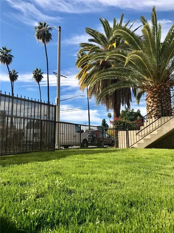 a view of a yard in front of a house
