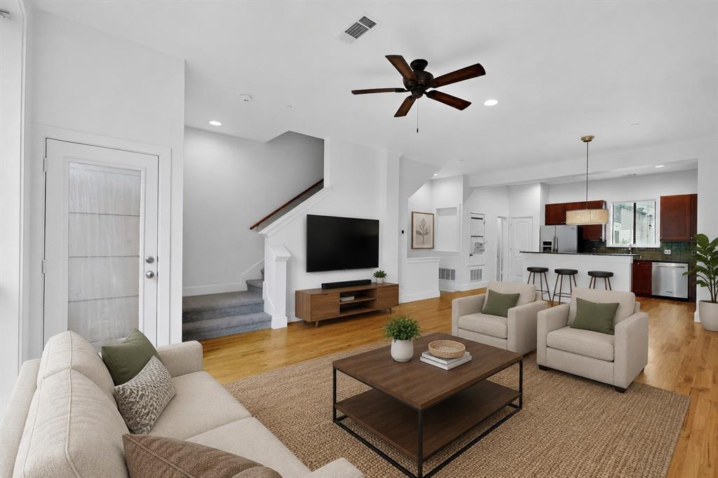 4211 Rawlins Street, Unit 528 Dallas, TX 75219 - Photo 6 of 14 Open-concept living area featuring wood-finish flooring, a contemporary ceiling fan, and recessed lighting