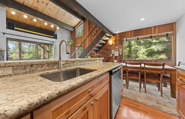 a kitchen with a sink and a large window
