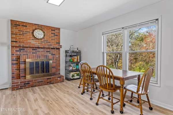 a view of a dining room with furniture and window