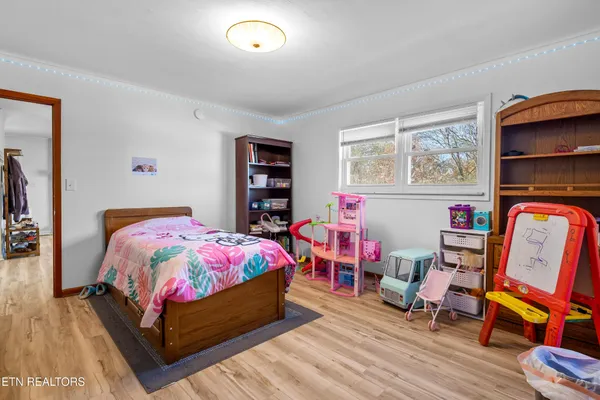 a bedroom with a bed and a dresser