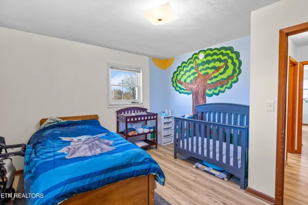 a bedroom with bed and a window