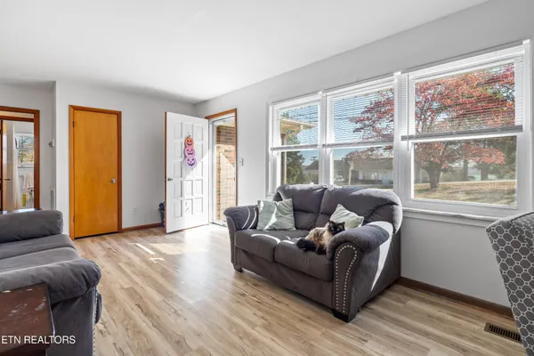 a living room with furniture and a large window