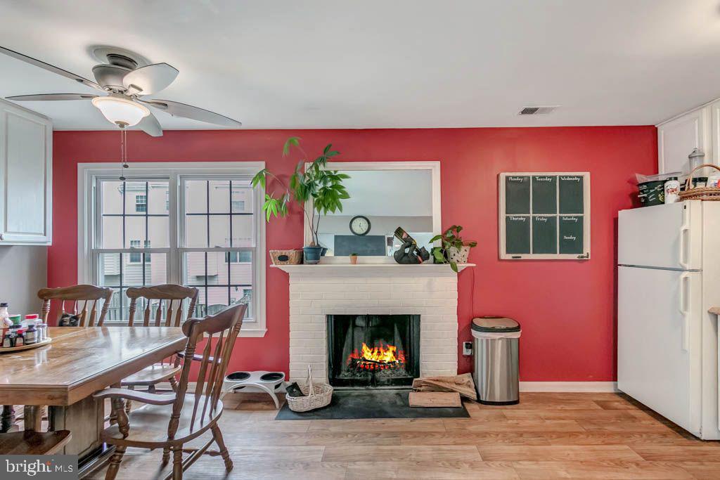 1677 Brice Court Crofton, MD 21114 - Photo 13 of 34 a living room with furniture a window and a fireplace