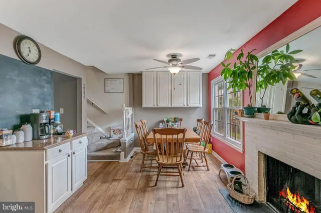 a kitchen with furniture and a fireplace
