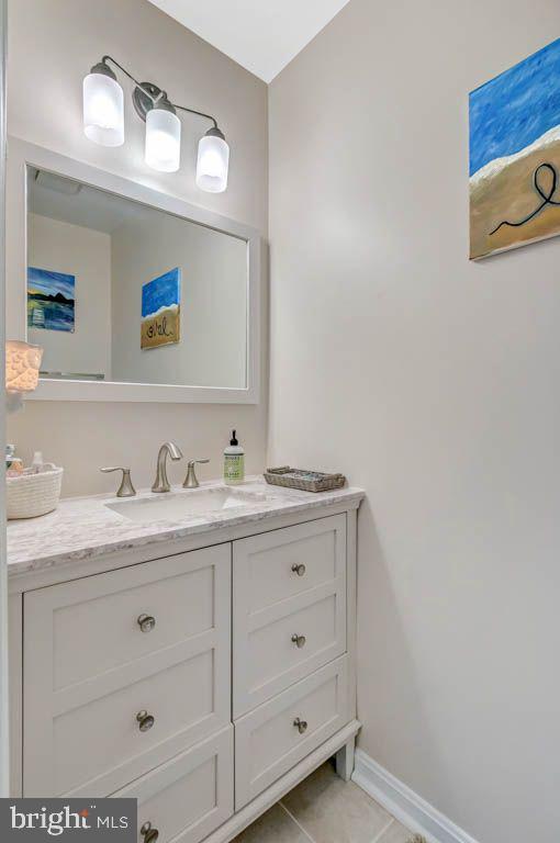 1677 Brice Court Crofton, MD 21114 - Photo 17 of 34 a bathroom with a granite countertop sink vanity and mirror
