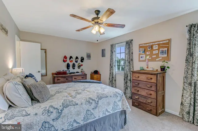 a bedroom with a bed and dresser