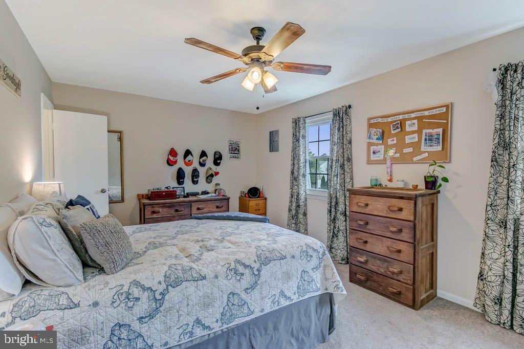 1677 Brice Court Crofton, MD 21114 - Photo 18 of 34 a bedroom with a bed and dresser