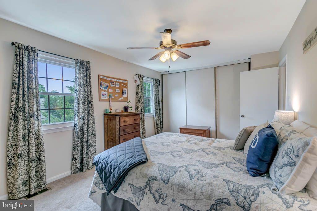 1677 Brice Court Crofton, MD 21114 - Photo 20 of 34 a bedroom with a large bed and a window