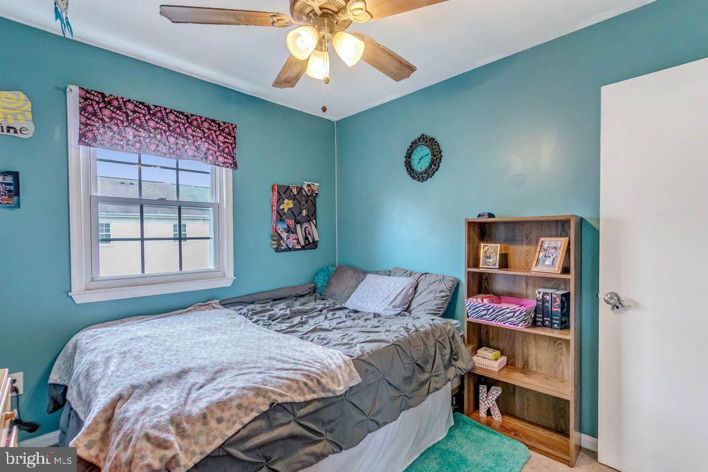 1677 Brice Court Crofton, MD 21114 - Photo 25 of 34 a bedroom with a bed and a window