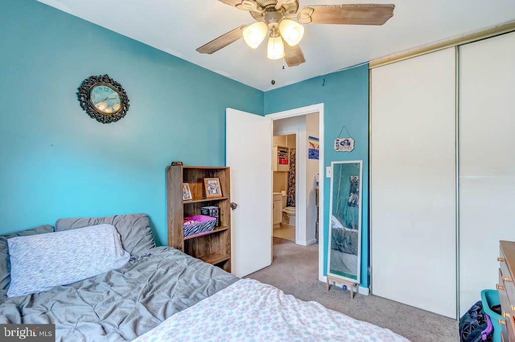 1677 Brice Court Crofton, MD 21114 - Photo 26 of 34 a living room with furniture and a flat screen tv