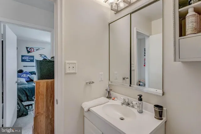 a bathroom with a sink and a mirror