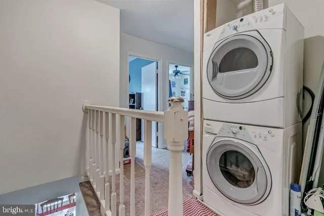 a view of a hallway with washer and dryer
