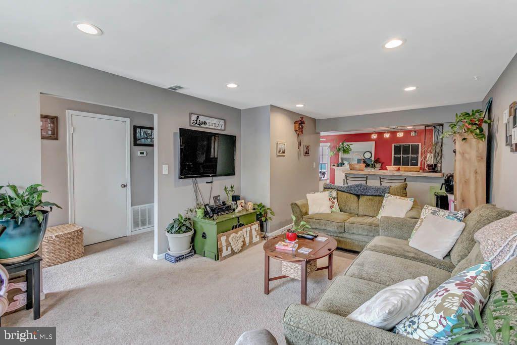 1677 Brice Court Crofton, MD 21114 - Photo 5 of 34 a living room with furniture and a flat screen tv