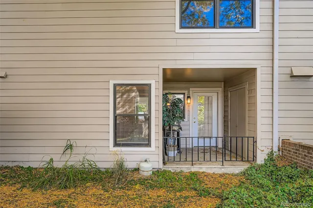 a view of a house with a tree