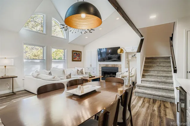 a dining room with furniture and wooden floor