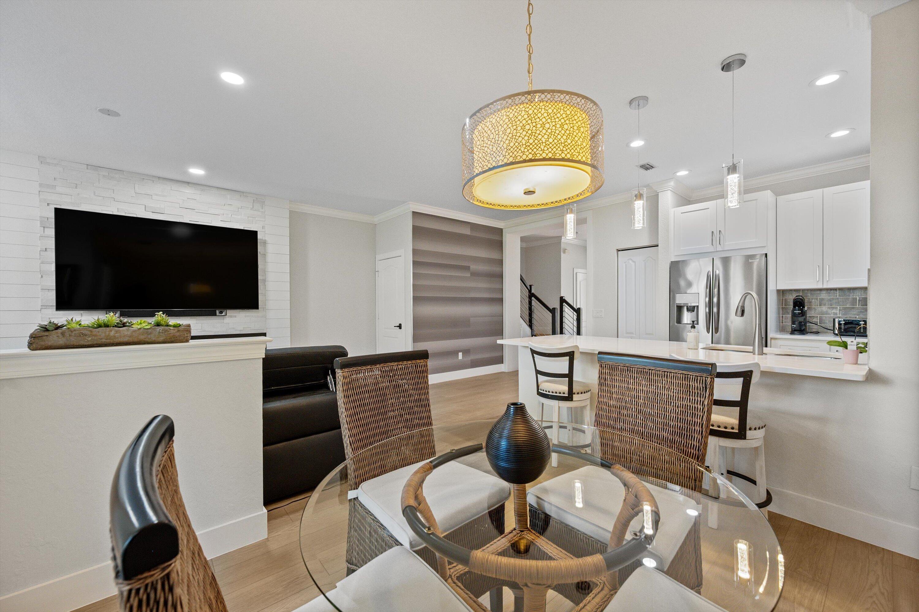 6058 Seminole Gardens Circle Riviera Beach, FL 33418 - Photo 15 of 47 a living room with furniture and a flat screen tv
