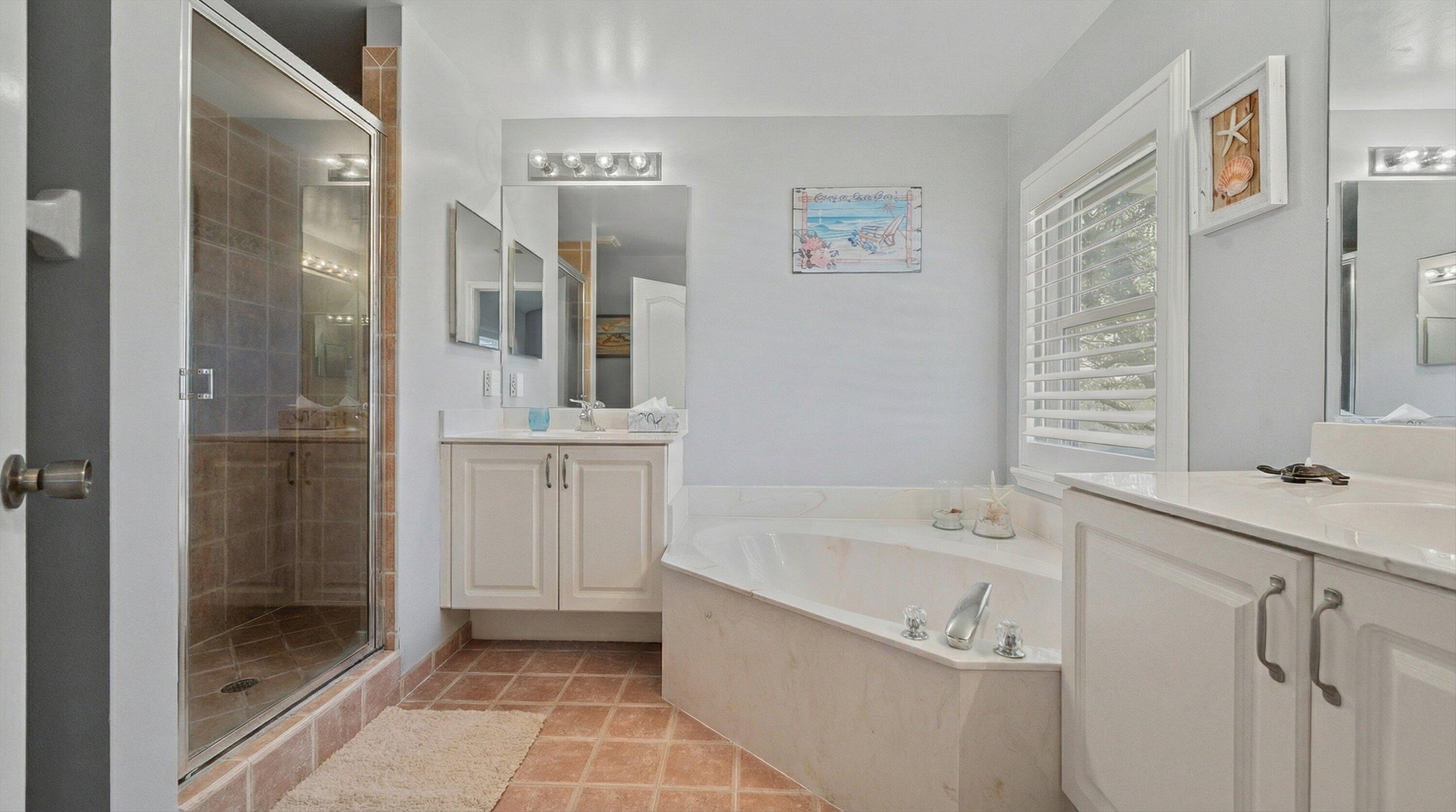 6058 Seminole Gardens Circle Riviera Beach, FL 33418 - Photo 21 of 47 a bathroom with a bathtub sink mirror and shower