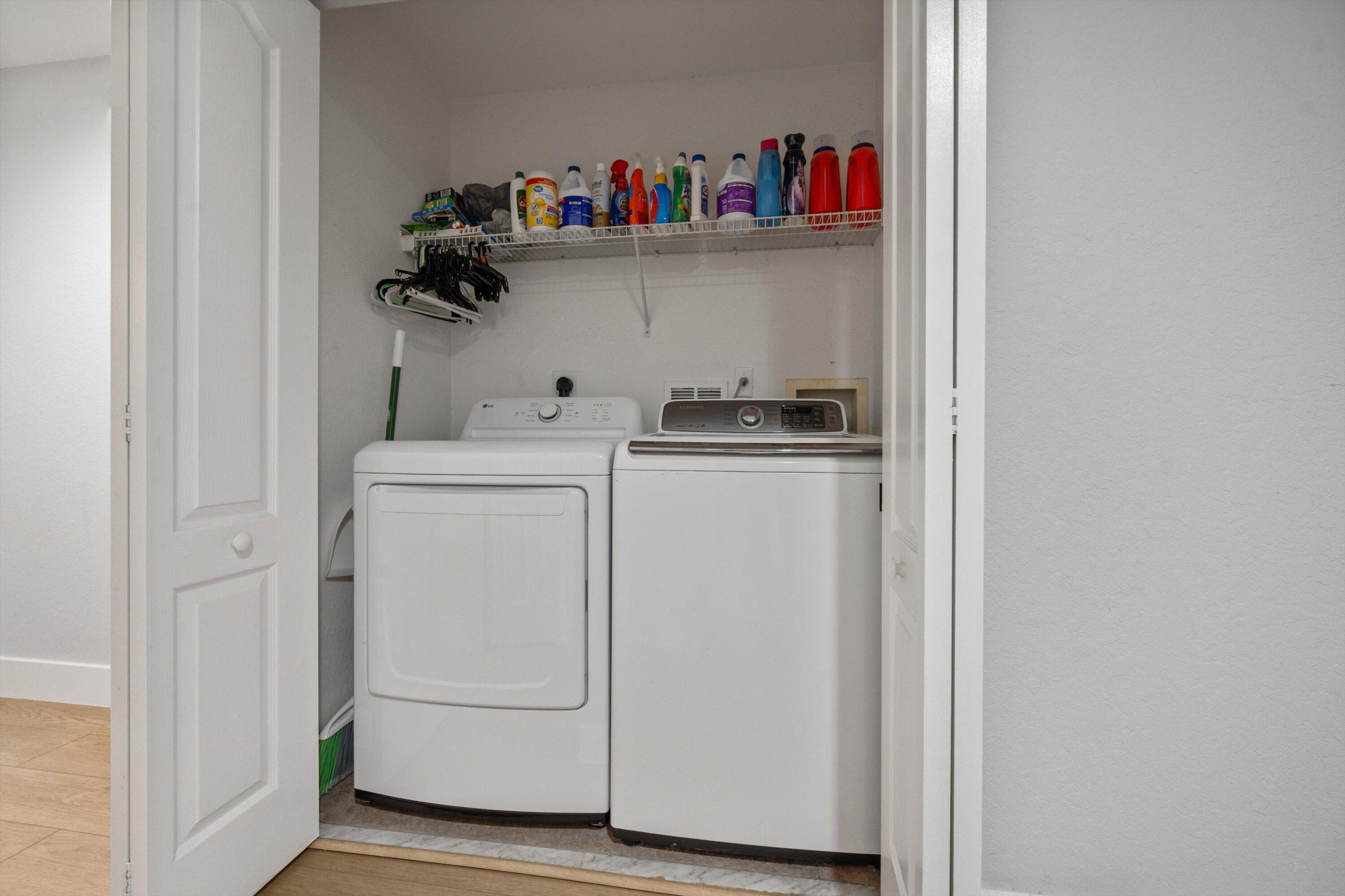6058 Seminole Gardens Circle Riviera Beach, FL 33418 - Photo 24 of 47 a utility room with dryer and washer