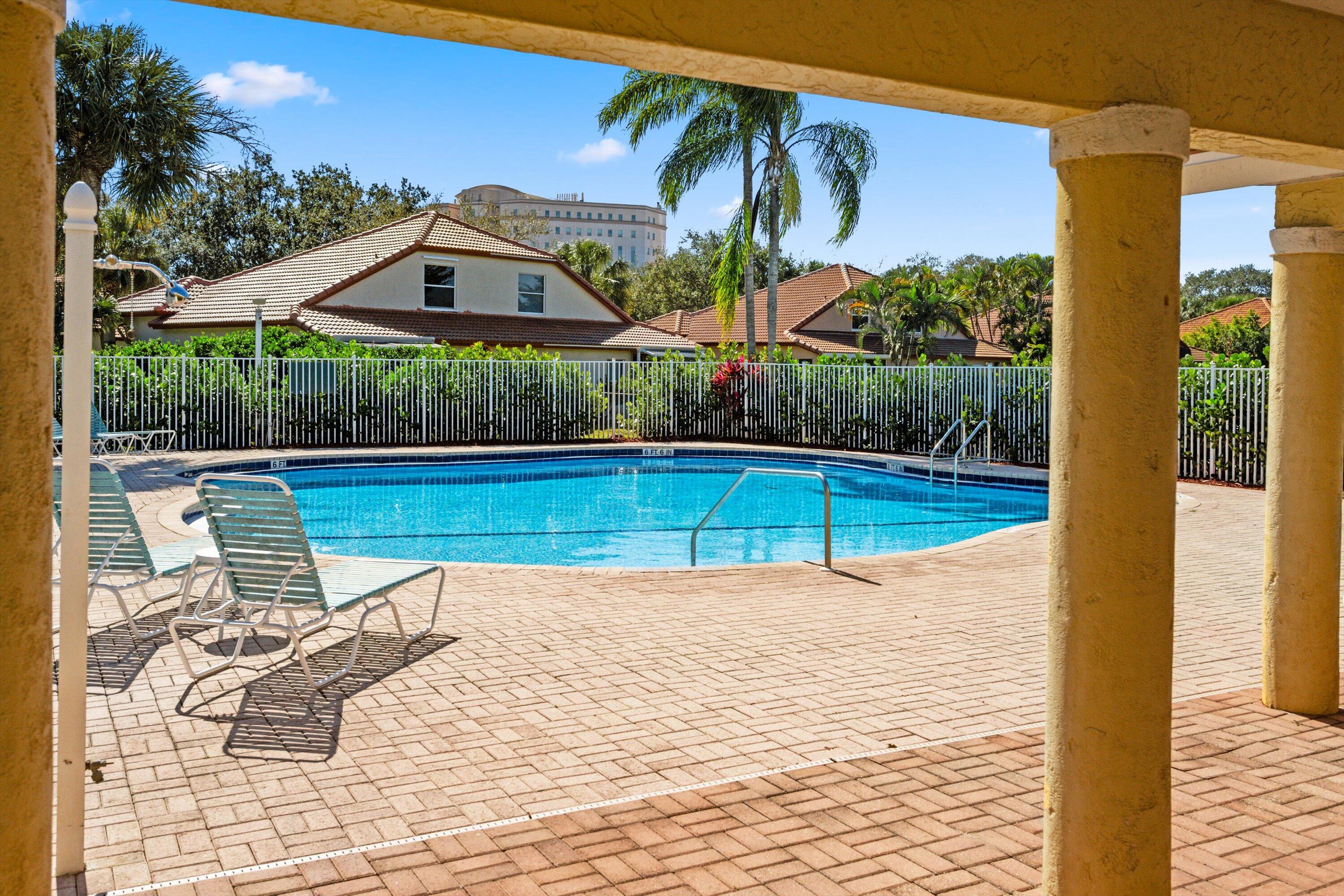 6058 Seminole Gardens Circle Riviera Beach, FL 33418 - Photo 31 of 47 a view of a swimming pool with a patio