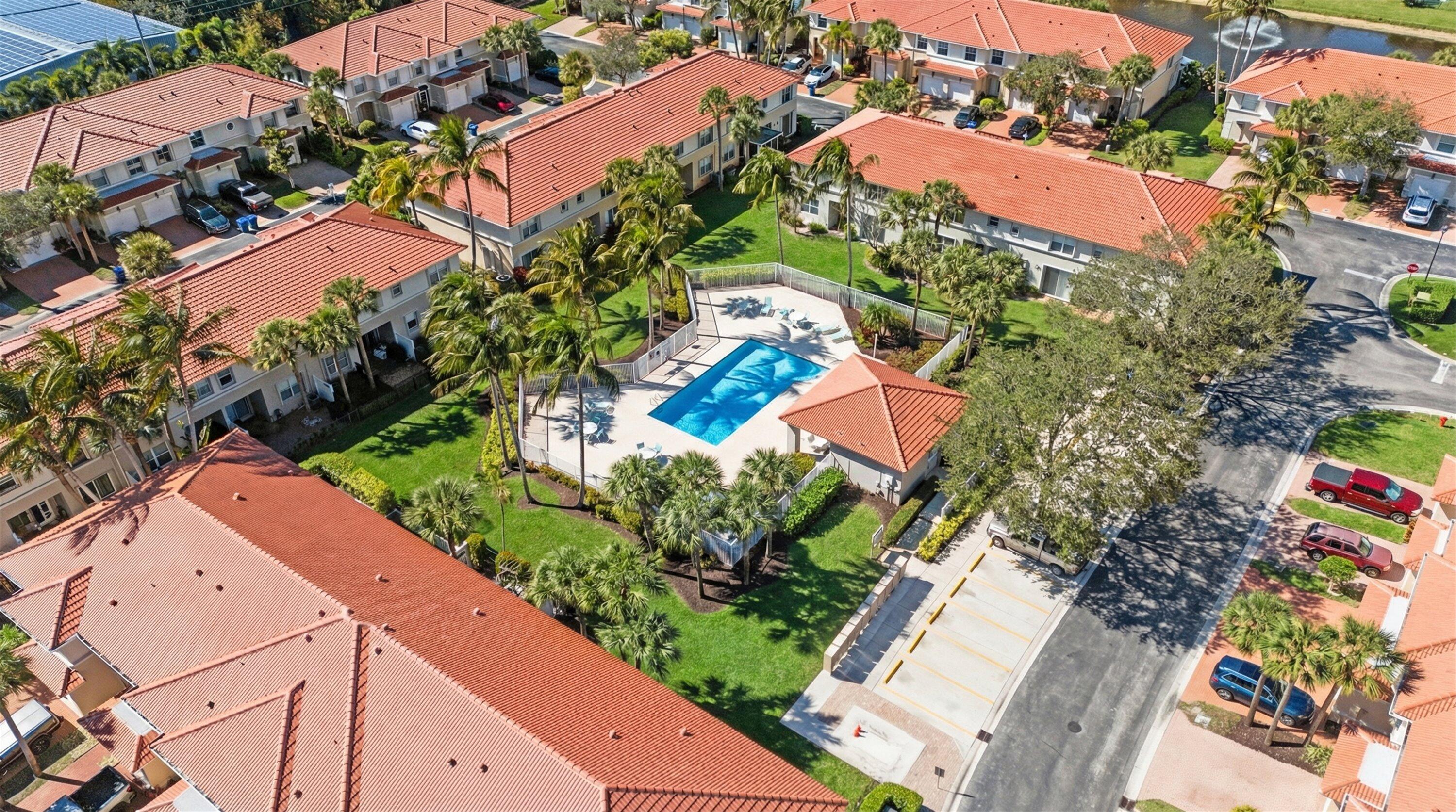 6058 Seminole Gardens Circle Riviera Beach, FL 33418 - Photo 4 of 47 an aerial view of residential houses with outdoor space