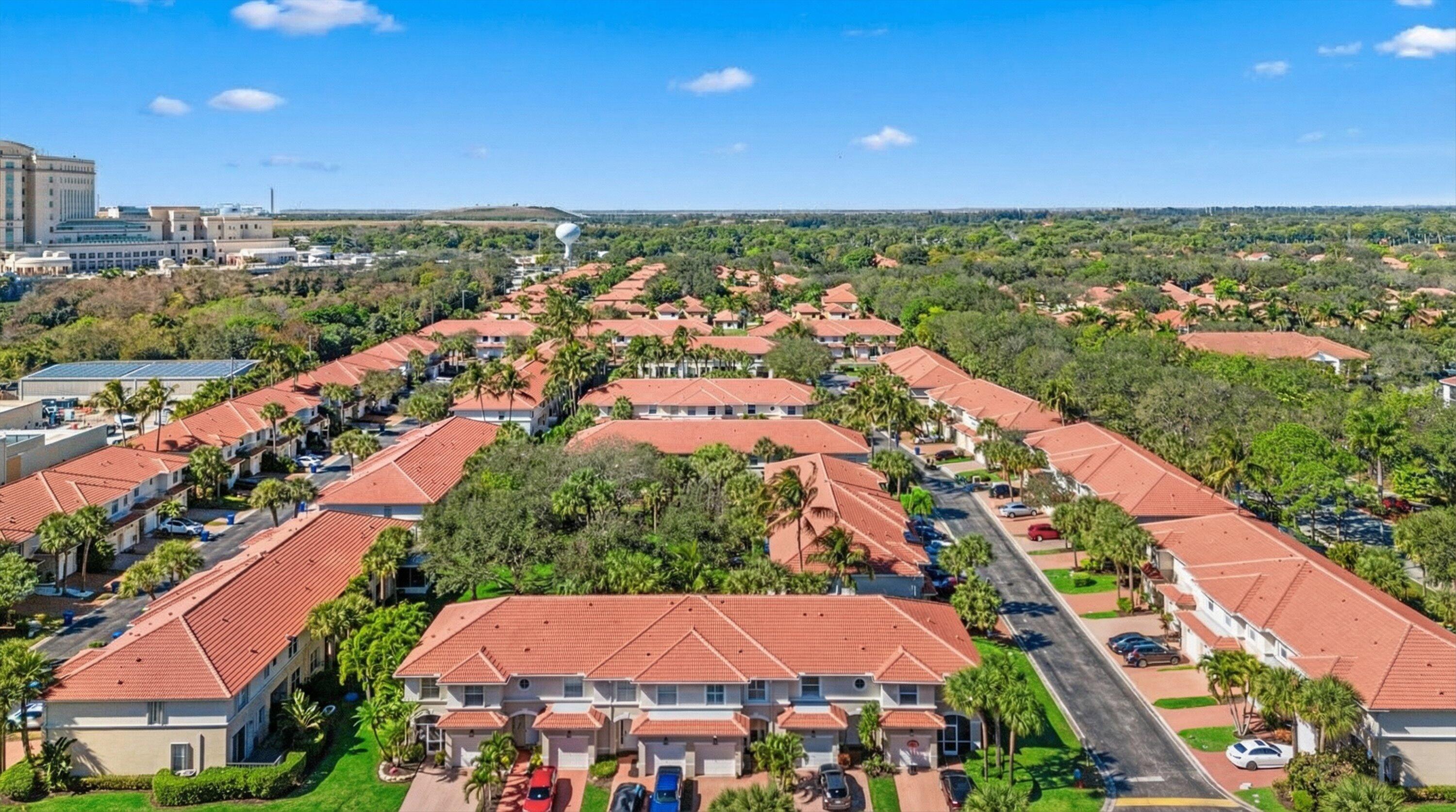 6058 Seminole Gardens Circle Riviera Beach, FL 33418 - Photo 41 of 47 an aerial view of residential houses with outdoor space and street view