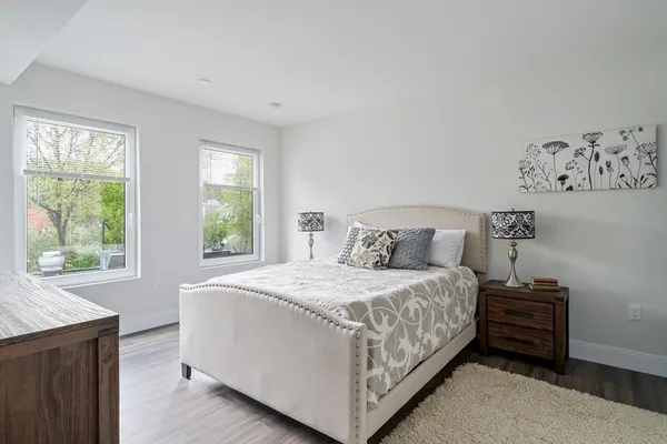 a bedroom with a bed and window