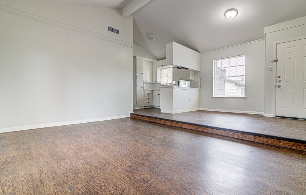 5703 Gloucester Lane, Unit A Austin, TX 78723 - Photo 2 of 11 a view of empty room with wooden floor and window
