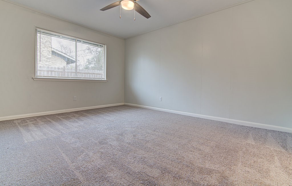 5703 Gloucester Lane, Unit A Austin, TX 78723 - Photo 8 of 11 an empty room with a window