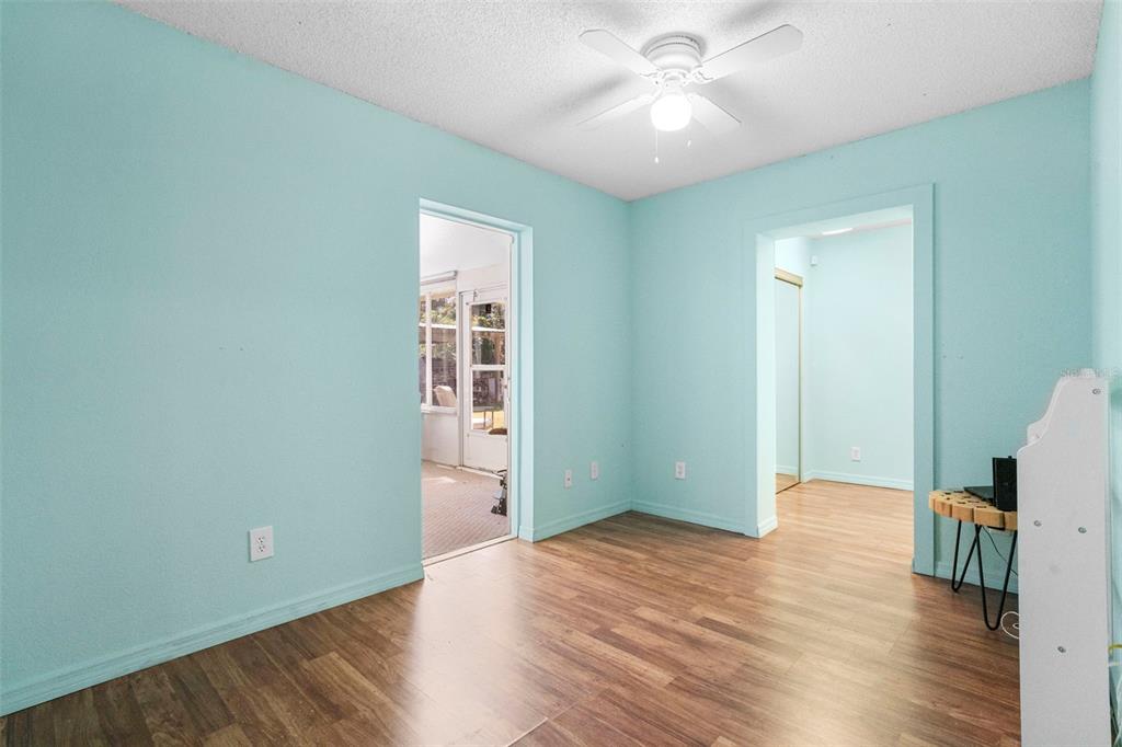 3080 Ragis Road Edgewater, FL 32132 - Photo 55 of 86 a view of livingroom with hardwood floor and ceiling fan