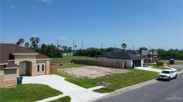 an aerial view of a house with yard swimming pool and outdoor seating